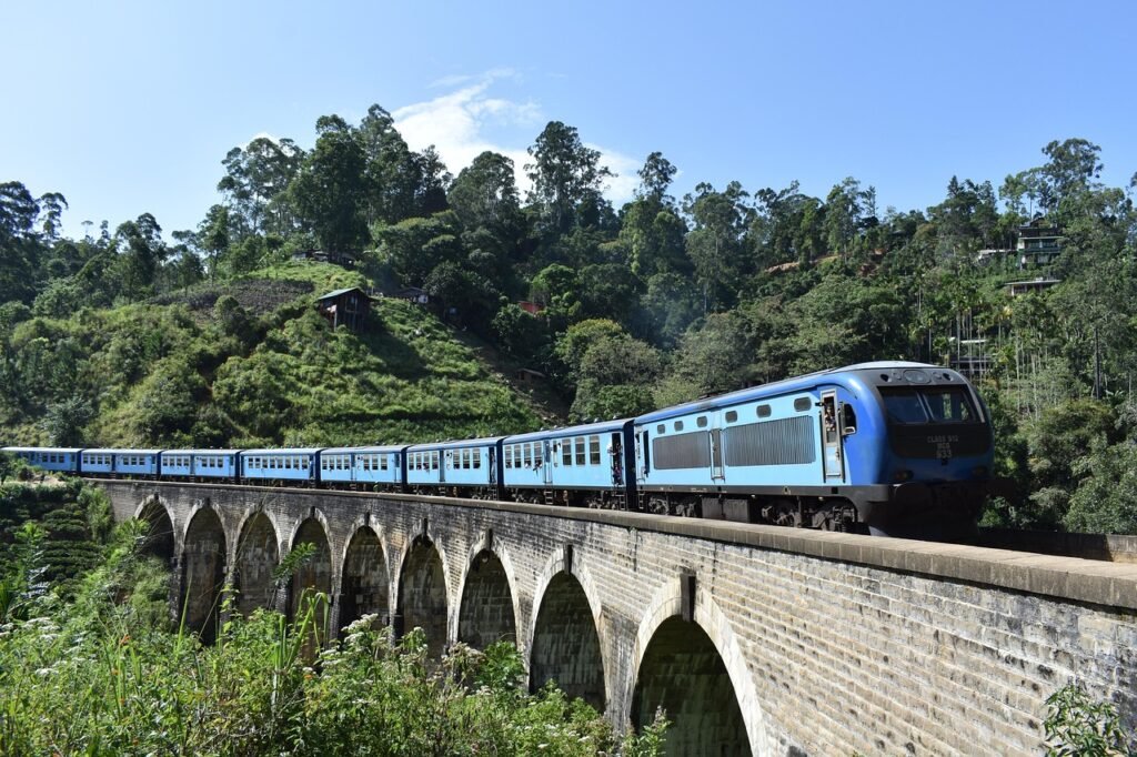 Scenic train journey through the mountains of Sri Lanka crossing the Nine Arch Bridge near Ella