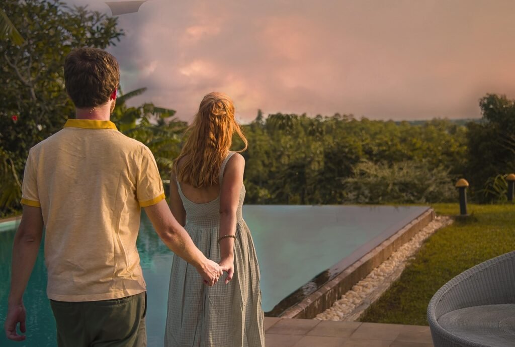 Couple enjoying a sunset overlooking Galle Fort and the southern coast of Sri Lanka from an infinity pool